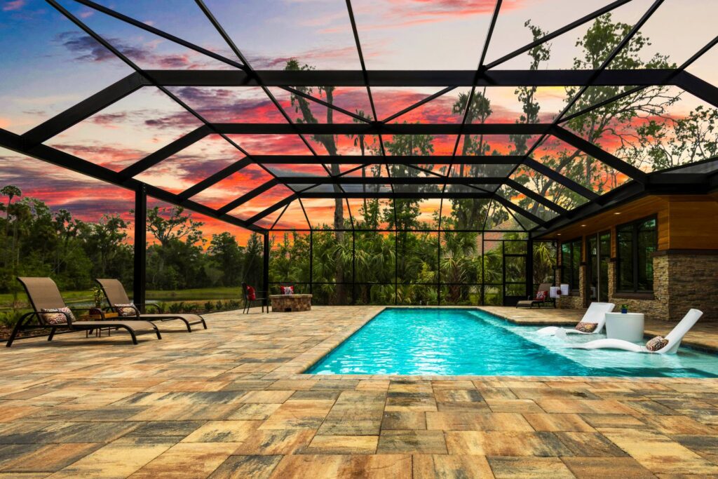 built in pool with wading deck and screen enclosure