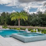 luxury pool with palm trees and whirlpool spa