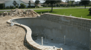 pool installation under construction with tile newly installed